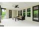 Spacious covered deck with ceiling fan and cushioned seating at 120 Lapis Lake Pt, Fayetteville, GA 30215