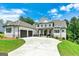 Beautiful two-story home featuring an attached garage, a driveway, and manicured landscaping at 120 Lapis Lake Pt, Fayetteville, GA 30215