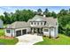 Beautiful home with a three-car garage, stone accents, lush lawn and well-kept landscaping at 120 Lapis Lake Pt, Fayetteville, GA 30215