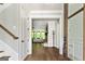 Inviting foyer with beautiful hardwood floors leading to a bright living area with a fireplace at 120 Lapis Lake Pt, Fayetteville, GA 30215