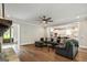 Spacious living room offering hardwood floors, an open layout and a view into the kitchen area at 120 Lapis Lake Pt, Fayetteville, GA 30215