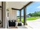 Welcoming front porch with comfortable seating area, stylish pillars, and scenic views at 120 Lapis Lake Pt, Fayetteville, GA 30215