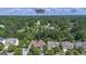 Aerial view of home at 474 Strawberry Walk in wooded setting; close proximity to Mall of Georgia at 474 Strawberry Walk, Loganville, GA 30052
