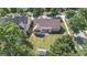 Beautiful aerial view of the house with large trees and a manicured lawn at 474 Strawberry Walk, Loganville, GA 30052