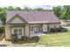 An expansive backyard features a patio, mature landscaping, and a charming bird bath area at 474 Strawberry Walk, Loganville, GA 30052