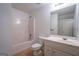 Bathroom with large mirror and white cabinets with sink and tile flooring at 474 Strawberry Walk, Loganville, GA 30052