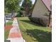 Manicured front yard on a sunny day with sidewalks and a sidewalk at 474 Strawberry Walk, Loganville, GA 30052