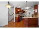 Stylish kitchen featuring stainless steel appliances, granite counters, and hardwood floors at 474 Strawberry Walk, Loganville, GA 30052