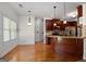 Cozy eat-in kitchen with a breakfast bar, stainless steel appliances, and hardwood floors at 474 Strawberry Walk, Loganville, GA 30052