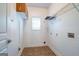 Utility room with tile flooring, metal shelving and washer dryer hookups at 474 Strawberry Walk, Loganville, GA 30052
