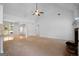 Spacious living room with vaulted ceilings, fireplace, and large windows allowing natural light at 474 Strawberry Walk, Loganville, GA 30052