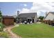 Expansive backyard with a cozy patio area, outdoor furniture, and a charming shed creating an inviting outdoor space at 2256 Long Bow Chase Nw, Kennesaw, GA 30144