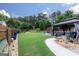 Spacious backyard with a gazebo, shed, and well-maintained lawn, perfect for outdoor activities and relaxation at 2256 Long Bow Chase Nw, Kennesaw, GA 30144