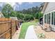 Spacious backyard with a gazebo and a walkway bordered by rocks and greenery, perfect for relaxation at 2256 Long Bow Chase Nw, Kennesaw, GA 30144
