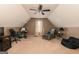 Spacious bonus room offering versatile usage with a ceiling fan, cozy seating, and natural light at 2256 Long Bow Chase Nw, Kennesaw, GA 30144