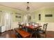 Dining room with wood floors, green walls, and a decorative dining table at 2256 Long Bow Chase Nw, Kennesaw, GA 30144