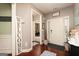 Inviting foyer with hardwood floors, neutral paint, and a view of other rooms at 2256 Long Bow Chase Nw, Kennesaw, GA 30144