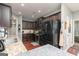 Spacious kitchen featuring granite countertops, stainless steel appliances, and wood floors at 2256 Long Bow Chase Nw, Kennesaw, GA 30144