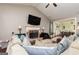 Cozy living room with vaulted ceiling, fireplace, and comfortable sectional sofa at 2256 Long Bow Chase Nw, Kennesaw, GA 30144