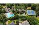 Aerial view showcasing a community pool, tennis courts, and lush landscaping at 162 Daltree Ct, Marietta, GA 30068