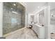 Well-lit bathroom featuring a glass shower, white cabinetry, and dual sinks at 162 Daltree Ct, Marietta, GA 30068