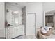 Bathroom showcasing white cabinets, marble countertops, and a luxurious soaking tub at 162 Daltree Ct, Marietta, GA 30068
