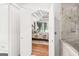 A primary bathroom transitions to a bedroom through an arched doorway and has marble finishes at 162 Daltree Ct, Marietta, GA 30068