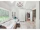 A bright primary bathroom featuring a jetted tub, a chandelier and a stained-glass window at 162 Daltree Ct, Marietta, GA 30068