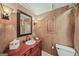 Elegant bathroom featuring a wood vanity with vessel sink and decorative mirror at 162 Daltree Ct, Marietta, GA 30068