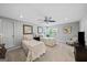 Bright bedroom featuring two twin beds, ceiling fan, and neutral decor, providing a comfortable and versatile space at 162 Daltree Ct, Marietta, GA 30068