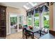 Cozy breakfast nook with skylights, banquette seating, and an adjacent screened porch at 162 Daltree Ct, Marietta, GA 30068