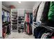 Walk-in closet with custom shelving and metal pull-out baskets provides ample storage space at 162 Daltree Ct, Marietta, GA 30068