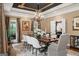 Elegant dining room featuring a decorative ceiling, chandelier, and natural light at 162 Daltree Ct, Marietta, GA 30068