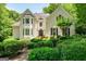 Charming two-story brick home with well-manicured landscaping and a symmetrical facade at 162 Daltree Ct, Marietta, GA 30068
