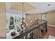 Elegant foyer featuring a grand staircase, a striking chandelier, and a view of the living room with fireplace at 162 Daltree Ct, Marietta, GA 30068