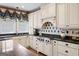Updated kitchen with stainless steel appliances, custom cabinets, and sleek countertops at 162 Daltree Ct, Marietta, GA 30068