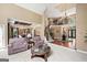 Spacious living room with a grand staircase, elegant furnishings, and a view of the dining area at 162 Daltree Ct, Marietta, GA 30068