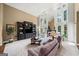 Sunlit living room boasting soaring windows, custom built-ins, and a cozy fireplace at 162 Daltree Ct, Marietta, GA 30068