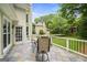 Outdoor deck featuring a seating area overlooking the yard with mature trees at 162 Daltree Ct, Marietta, GA 30068