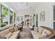 Inviting screened patio with cozy seating, tiled flooring and views of the backyard at 162 Daltree Ct, Marietta, GA 30068