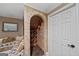 Unique stone wine cellar showcasing wine storage and a cozy seating area at 162 Daltree Ct, Marietta, GA 30068