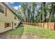 A sprawling backyard featuring an attractive privacy fence and lush greenery, ideal for outdoor living and entertainment at 500 Pomona Circle Sw, Atlanta, GA 30315