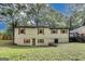 Backyard features a fenced yard, mature trees, and deck access at 500 Pomona Circle Sw, Atlanta, GA 30315