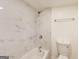 This bathroom offers a tiled shower with a tub and new fixtures at 500 Pomona Circle Sw, Atlanta, GA 30315