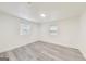 Bedroom features two windows, recessed lighting, and gray vinyl flooring at 500 Pomona Circle Sw, Atlanta, GA 30315