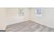 Bright bedroom features two windows and stylish gray vinyl flooring at 500 Pomona Circle Sw, Atlanta, GA 30315