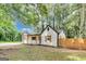 Attractive house with wooden shutters, a covered front porch, and a new wooden fence at 500 Pomona Circle Sw, Atlanta, GA 30315