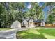 This inviting property features a detached garage, modern fence, and a freshly paved driveway at 500 Pomona Circle Sw, Atlanta, GA 30315
