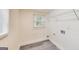 A bright laundry room with shelving, hookups, and a window for natural light at 500 Pomona Circle Sw, Atlanta, GA 30315