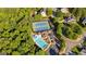 Aerial view of community amenities including a pool and tennis court enhancing the neighborhood appeal at 1210 Magnolia Park Cir, Cumming, GA 30040